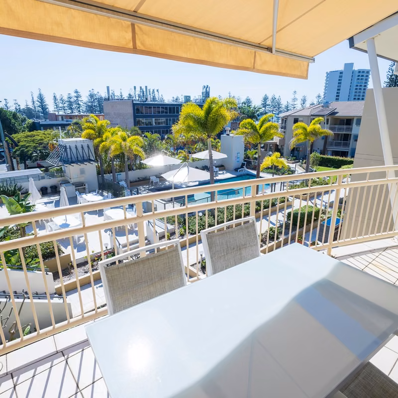 Instagram post by The Village at Burleigh, tile 3 Private balcony looking over palms and the pool at The Village at Burleigh, Burleigh Heads